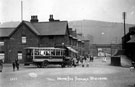 View: v00772 The first Corporation bus at the terminus, outside Samuel Dewhurst, outfitters, Fife Street (formerly Fowler Street) Monday 17th March 1913 with Midland Railway Bridge in the background