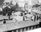 Elevated view of City Centre (looking towards Norfolk Street) from the roof of Central Library. Roof of John Round and Son Ltd, Tudor Works, Tudor Street, foreground, buildings in background include St. Marie's RC Church and Nether Congregational Cha Elevated view of City Centre (looking towards Norfolk Street) from the roof of Central Library. Roof of John Round and Son Ltd, Tudor Works, Tudor Street, foreground, buildings in background include St. Marie's RC Church and Nether Congregational Cha
