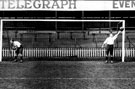Goalkeeper in action possibly Sheffield Wednesday but in an England shirt