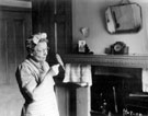 Edith Shaw with her budgerigar at 51 Nidd Road, Darnall