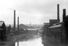 River Don at Royds Mill Stream (left), manufacturing chemists (left centre), Effingham Steel Works (right) and All Saints Church, Burngreave in the background