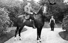 Gardener, horse and rider in the grounds of Whirlow House, off Ecclesall Road South. Home of Edgar Allen, Steel Manufacturer. The horseman was a former jockey Gardener, horse and rider in the grounds of Whirlow House, off Ecclesall Road South. Home of Edgar Allen, Steel Manufacturer. The horseman was a former jockey