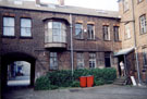 The entrance to the yard and managers bow windowed office of the former Joseph Pickering and Sons Ltd., white shoe cleaner manufacturers, Albyn Works, Burton Road, Neepsend