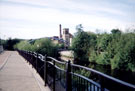 Riverside Walk looking towards the footbridge over the River Don to Nursery Street with Holy Trinity Church and Aizlewoods Mill (formerly Crown Corn Mill of John Aizelwood Ltd) in the background