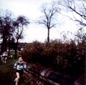View: v01999 No. 148, Robert Rhodes, Rotherham Harriers out on the course of the under 11's South Yorkshire Cross Country League, Hillsborough Park near the Library