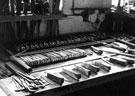 Workbench at Stan Shaw, Garden Street, showing pocket-knives at various states of assembly