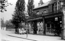 Nether Edge Road showing the Post Office, run by the Holt family and Hubbard's Drapery shop Nether Edge Road showing the Post Office, run by the Holt family and Hubbard's Drapery shop