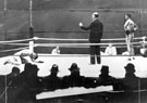 11th Round of Johnny Cuthbert (on the canvas) v Nel Tarleton boxing at Liverpool's Anfield Road Football Ground