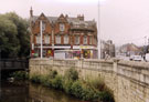Nos. 389 Pizza and Co and 391 The Barber Shop, Walkley Lane and Gee Vee Travel No. 23 Holme Lane showing Hill Bridge (extreme left) over the River Loxley