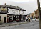 Upperthorpe Hotel, No. 159 and 161 A. Twelvetree, furniture and carpet dealer, Upperthorpe Road with the former Public Baths in the background