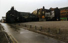 Car Park adjacent to the rear of No. 23 Carver Street former premises of John Turton Co. Ltd. cutlery manufacturer (right) showing the rear of derelict cutlery workshops 29 Carver Lane (left) looking towards Division Street