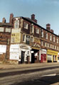 Nos. 87; 91 The Bookshop; 93 M. and L. Insurance Brokers, Spital Hill showing the entrance to Vaux Tyres (formerly John Sorby and Son, Spital Hill Works)