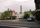 View: v02692 Bus shelter, Holme Lane and the junction with Walkley Lane showing Hill Bridge, chimney of the Wire Works and the rear of the Midland Bank building, Langsett Road