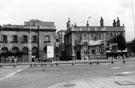 Former Victoria Station steps and lift entrance with public toilets in front; No. 126 Furnishing Direct (formerly National Provincial Bank) and 122, Wicker from the junction with Walker Street