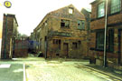 Derelict former premises of Jessop and Smith, cutlery forger and Alex Downing, Trafalgar Engineering Works from Canning Street looking towards Devonshire Lane