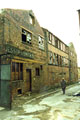 Derelict former premises of Jessop and Smith, cutlery forger and Alex Downing, manufacturing silversmiths and cutlers, Trafalgar Engineering Works from Canning Street looking towards Devonshire Lane