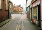 Looking east towards West Street from Convent Walk showing Glossop Road Baths (extreme left); Foundry and Firkin public house (formerly Bee Hive), No 240, West Street