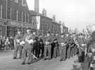 During the visit of the Queen and The Duke of Edinburgh, 616 Squadron Royal Auxiliary Air Force, R.A.F. Norton Bagpipe Band marching past J.E.Morrison and Son, Granville Works, Tenter Street (Nos 82, 80 etc in the background)