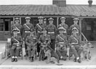 The Guardroom and dogs with Wing Commander Ken A. Mummery centre, R.A.F. Norton