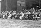 Spectators, Battle of Britain Day, R.A.F. Norton mid 1950's with Wing Commander Ken A. Mummery seated 4th from right front row