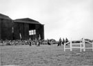 Police dog display by team from R.A.F. Police Depot, Netheravon at Battle of Britain Day, R.A.F. Norton 1955