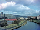 Sheffield and South Yorkshire Navigation  at Tinsley Locks showing the access bridge to Tinsley Rolling Mills over the River Don (left)