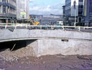 Castle Square showing the Hole in the Road under construction  with T. B. and W. Cockayne Ltd (left), Hornes, tailors with the Vulcan Sculpture by Boris Tietze ; Peter Robinson (right) 
