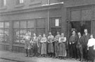 Members of staff outside John Truswell Ltd., provision merchants and pork butchers, No. 69 Allen Street Members of staff outside John Truswell Ltd., provision merchants and pork butchers, No. 69 Allen Street