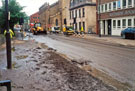 Nursery Street the day after the flood looking towards Holy Trinity Church showing Riverside House, Johnson Lane and Laurel Works (right)