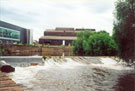 River Don at Brightside Weir 2 days after the flood with Load Hog Ltd. (left) and Sheffield Forgemasters in the background