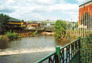 River Don at Hadfields Weir looking towards the debris brought down by the flood under Hadfields Bridge outside  Meadowhall Shopping Centre 