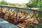 Debris left from the flood on the bridge carrying the gas main over the River Don near Bright side Bridge