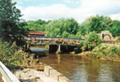 Debris left from the flood on the bridge carrying the gas main over the River Don with Brightside Bridge in the background