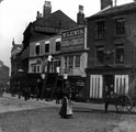 View: w00130 High Street prior to street-widening of 1896, No. 4 J. Preston, chemist, No. 6 William Lewis, tobacconist, No. 8 White Bear Inn, Nos. 10 - 14 William Foster and Son Ltd., tailors