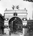 Queen Victoria's visit to Sheffield showing decorative arch at junction of Broad Street and South Street, Park, photographed from South Street looking towards Broad Street. Premises in background include Broad Street Cafe