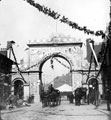 Decorative arch on Barker's Pool for the royal visit of Queen Victoria. Fargate in the background