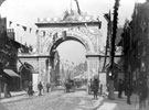 View: w00274 Decorative arch on Barker's Pool for the royal visit of Queen Victoria. Fargate in the background