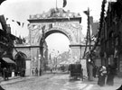 Decorative arch on Barker's Pool for the royal visit of Queen Victoria. Fargate in the background