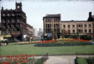 View towards Norfolk Street and Howard Street from the Peace Gardens, prior to demolition of buildings. Premises include Howard Chambers