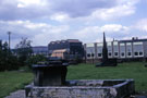 Memorial to Benjamin Huntsman, inventor of Crucible Steel  1704-1776, Hill Top Burial Ground, Attercliffe Common with former British Steel Corporation Gun Shop, River Don Works in the background