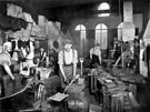 Edge tool production. Spade and shovel finishing, Ward and Payne Ltd., Limbrick Works, Limbrick Road