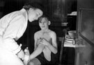 Boy receiving medical treatment, Wadsley Bridge Council School, Penistone Road North