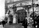 View: y00559 Pinstone Street, Construction of decorative arch for Queen Victoria's visit to officially open the Town Hall, designed, modelled and erected by Percy J. Roberts (based at 66, West Street)