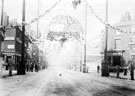 Decorations for Queen Victoria's visit, South Street, Moor at junctions with Earl Street and Rockingham Street, No. 79 Pump Tavern, left, No 74, Howard Brothers, butchers, right