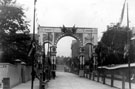 Decorative arch on Glossop Road to celebrate the royal visit of King Edward VII and Queen Alexandra