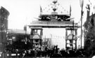 Decorative arch on Savile Street to celebrate the royal visit of King Edward VII and Queen Alexandra, sponsored by John Brown and Co., designed and erected by G.H. Hovey