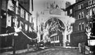 View: y00768 High Street/Market Place (outside George Hotel, left), decorated for the royal visit of Prince and Princess of Wales (later to become King Edward VII and Queen Alexandra)