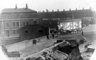 Sheffield Castle excavations recorded by J.B. Himsworth. Approach to Shambles Slaughter Houses from Blonk Street, Blonk Street Bridge and Sheffield Testing and Experimenting Works, left, Furnival Road in background