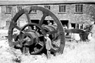 Dr. Dickenson at Jessopp's tilt hammers. Warehouse in background, Abbeydale Works, former premises of W. Tyzack, Sons and Turner Ltd., manufacturers of files, saws, scythes etc., prior to restoration and becoming Abbeydale Industrial Hamlet Museum
