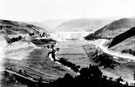 Construction of Howden Dam, Birchinlee village, left. Trestle Gantry Bridge, in foreground, left Construction of Howden Dam, Birchinlee village, left. Trestle Gantry Bridge, in foreground, left